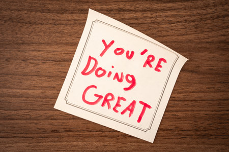 Sticky notes with a positive message, on a wooden background. Creative background.の写真素材