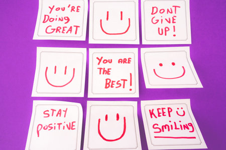 Sticky notes with a positive message, on a purple background. Creative background.の写真素材
