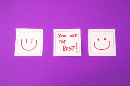 Sticky notes with a positive message, on a purple background. Creative background.の写真素材