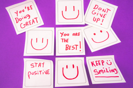 Sticky notes with a positive message, on a purple background. Creative background.の写真素材