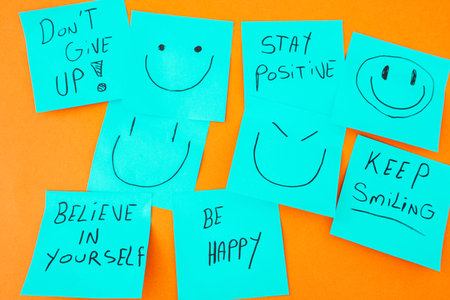 Sticky notes with a positive message, on an orange background. Creative background.の写真素材