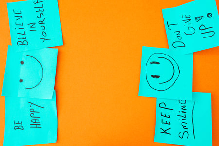 Sticky notes with a positive message, on an orange background. Creative background.の写真素材