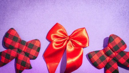 Christmas bow ties, on a purple background.