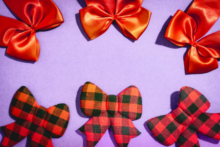 Christmas bow ties, on a purple background.
