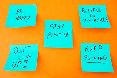 Sticky notes with a positive message, on an orange background. Creative background.の写真素材