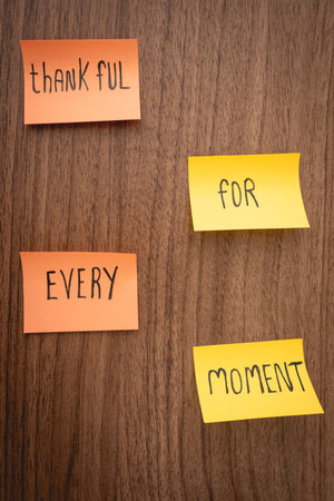 Positive and thankfull notes on a wooden background. Thanksgiving day.の写真素材