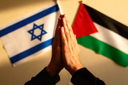AI generated images. Flags of Israel and Palestine. hands are praying. As a symbol of hope for peace.の素材