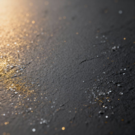 AI generated images. A structured dark gray background, with golden glitter and light. Background for Christmas or New Year.の素材