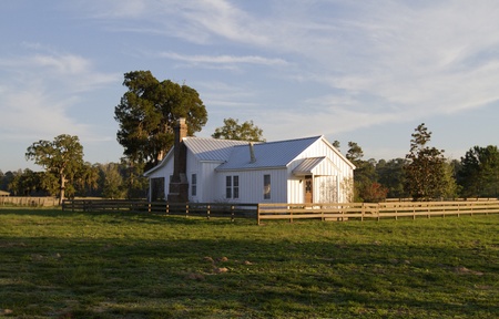 Old farm house in warm evening lightの写真素材