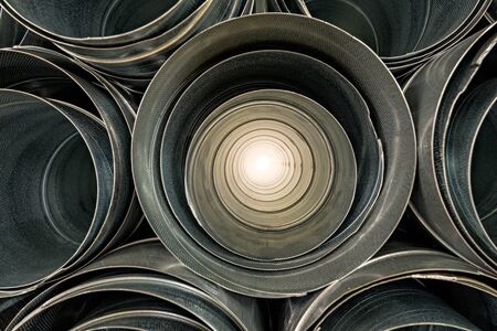 Metallic Pipes stacked in rows patternの写真素材