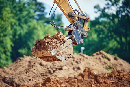 Backhoe - Bulldozer in open field operation
