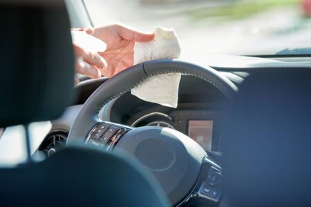 Disinfection of the interior of a driving school car, during the Coronavirus timeの写真素材