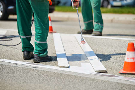 Road marking - Crosswalk painting, white painting on asphalt roadの写真素材
