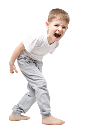 Upset child screaming standing isolated on white backgroundの写真素材