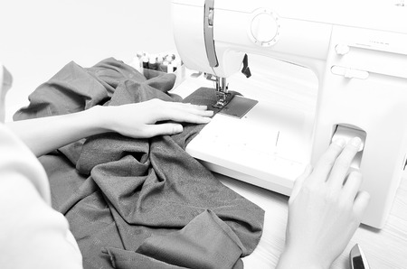 Seamstress in the process tailoringの写真素材