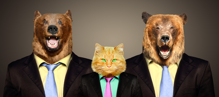 Cat guarded by two bears in business suitsの写真素材