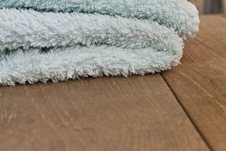 Towels on a wooden table. Photographed close-up