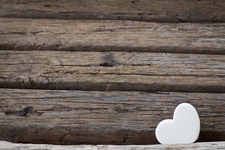 white heart on wood background. Idea of valentine concept.の写真素材