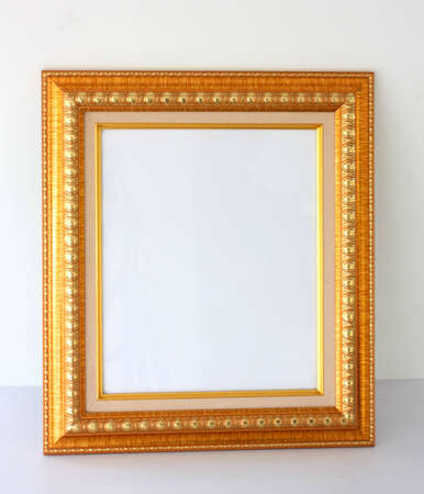 Gold picture frame ,isolated on whiteの写真素材