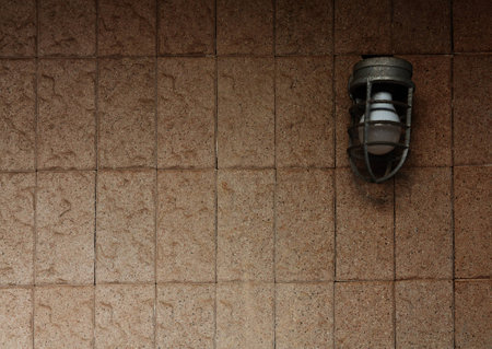 Lamp on stone wallの写真素材