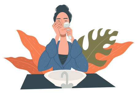 Woman using face roller for facial massage careのイラスト素材