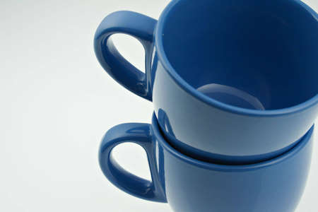 Blue coffee cups on the white background.の写真素材