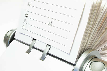Fragment of classic business card file isolated on a white background.の写真素材