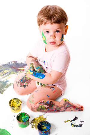 Portrait of  girl with painting colors. Isolated on white background.の写真素材