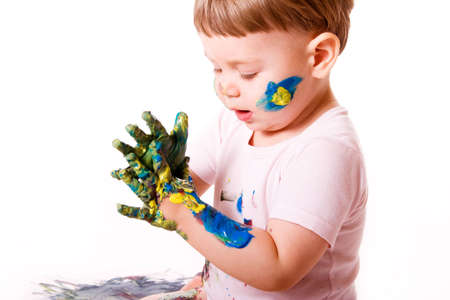  girl with stained hands. Isolated on white.の写真素材