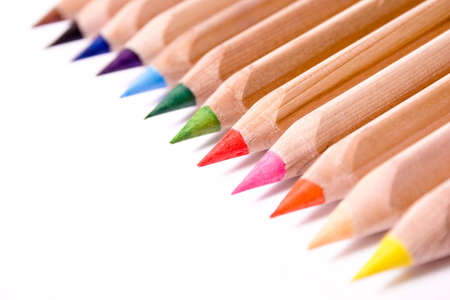 Row of colored pencils on white background.の写真素材