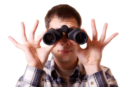 Man looking through binoculars. Isolated on white background.の写真素材