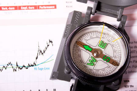 Compass with growing financial chart. Concept: your compass for emerging markets.の写真素材