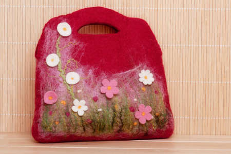 Handmade felt bag with floral decoration.の写真素材