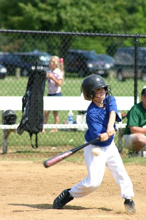 Boy Hitting Ball