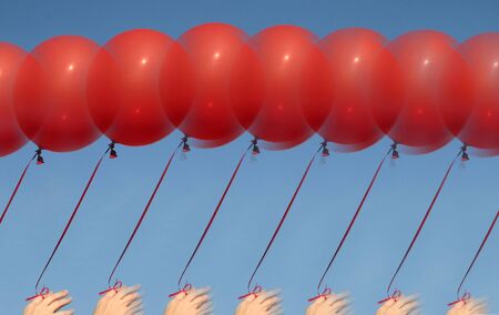 Person Holding Balloonsの写真素材