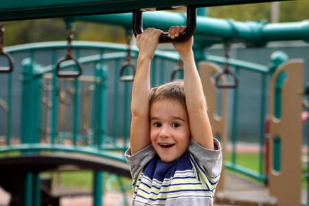Boy Playing on Playground