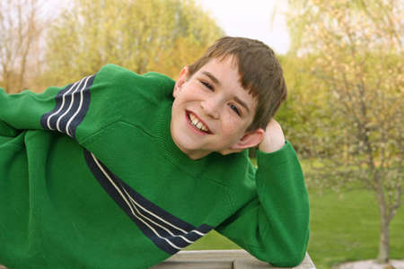 A teenage boy with a big smileの写真素材