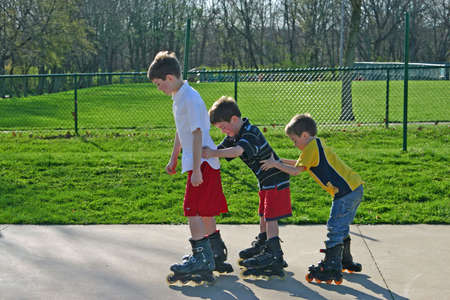 Kids Roller-Blading in a Row