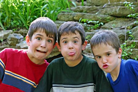 Three Boys All Making Silly Facesの写真素材