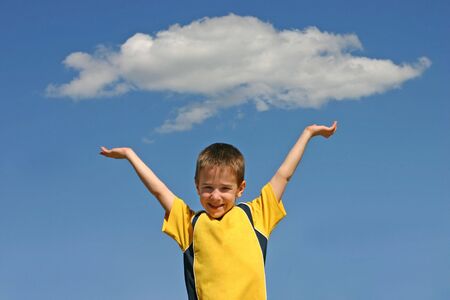 Boy Holding up a Cloudの写真素材