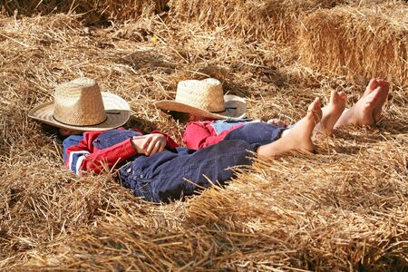 Farmers Asleep in the Hayの写真素材