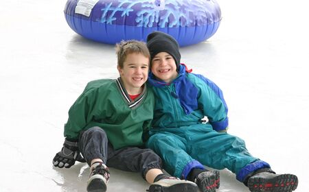 Boys Tubing on Iceの写真素材