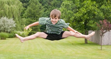 Boy Doing Jumps in the Airの写真素材