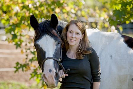 Woman Standing With Horse