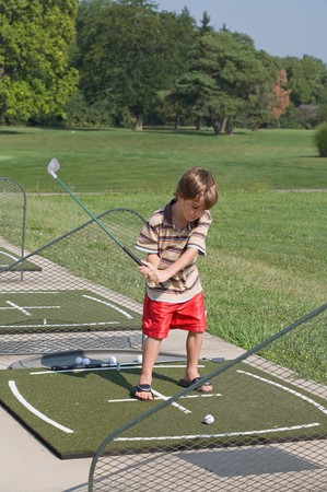 Little Boy Learning to Golfの写真素材