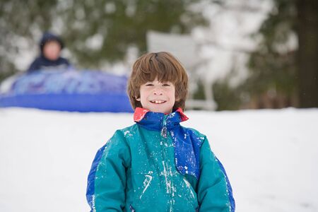 Boys Having Fun Sleddingの写真素材