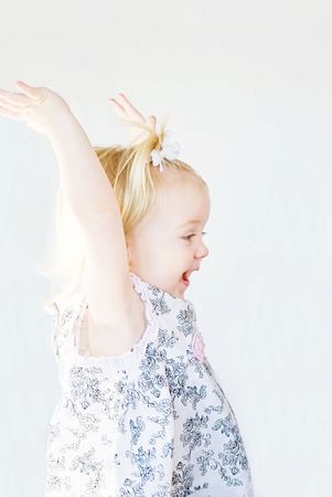 Cute Little Girl Playing With Arms Upの写真素材