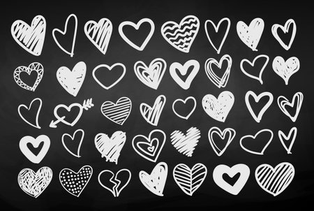 Heart doodles on chalkboard backgroundのイラスト素材