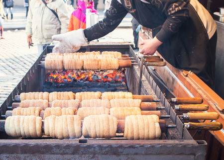 Prague, Czech Republic, 25.12.2014: Czech national winter street food called trdlo trdelnic is being cooked in the square of Prague during Christmas timeのeditorial素材
