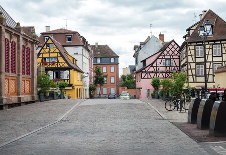 COLMAR, FRANCE - JUNE, 20: Colorful traditional french houses and empty road in Colmar, Alsace region, Franceの写真素材